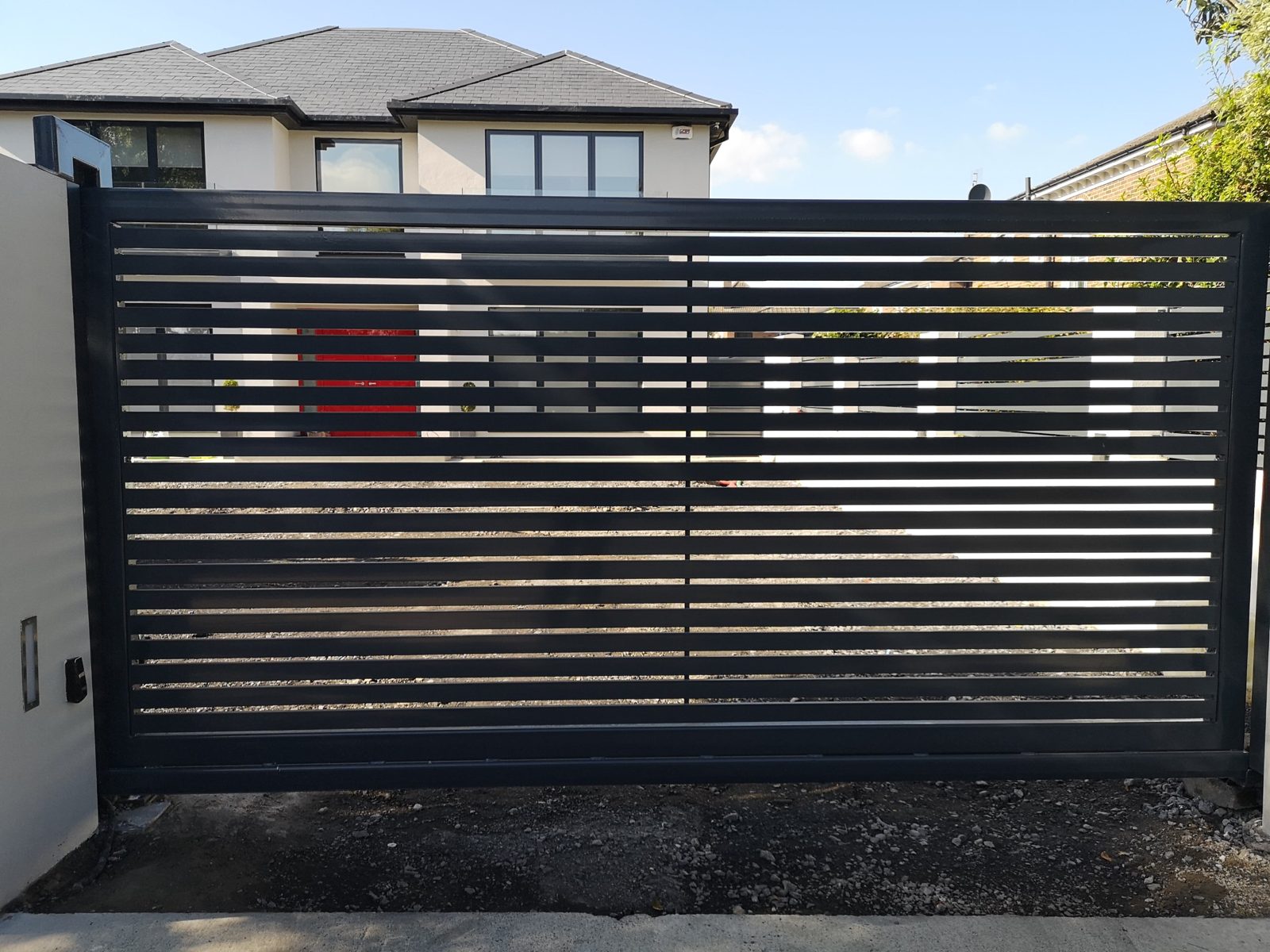 Slatted sliding gates like these for modern homes in Bangor